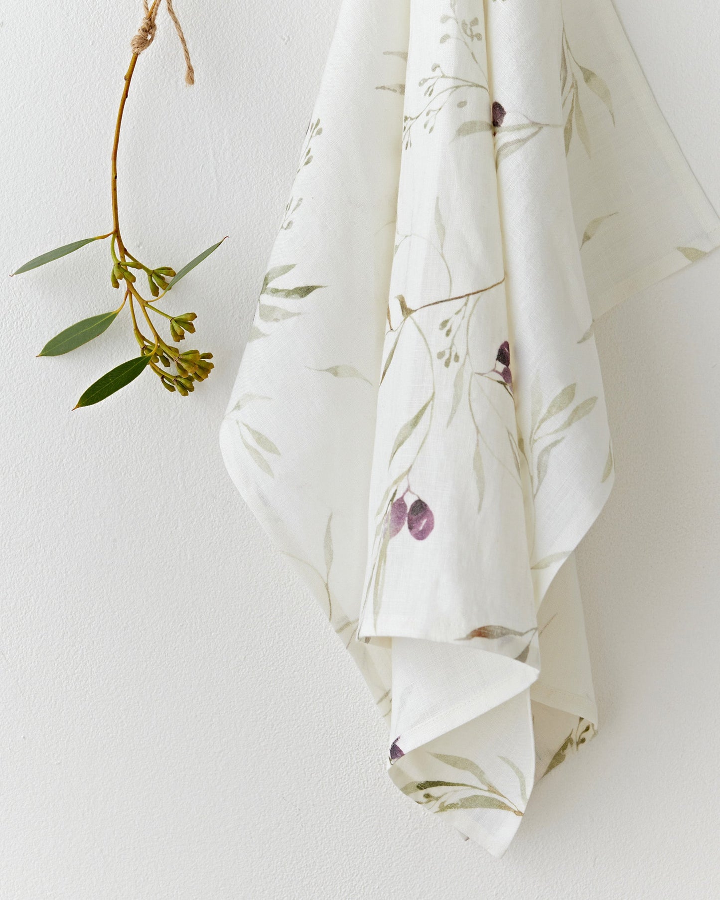 Linen tea towel in Olive orchard print on white | MagicLinen
