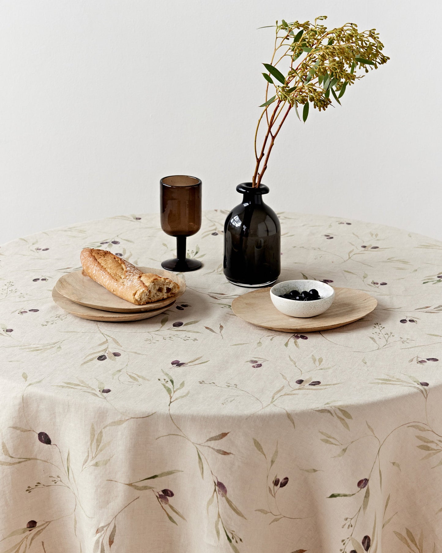 Round linen tablecloth in Olive orchard print on natural | MagicLinen