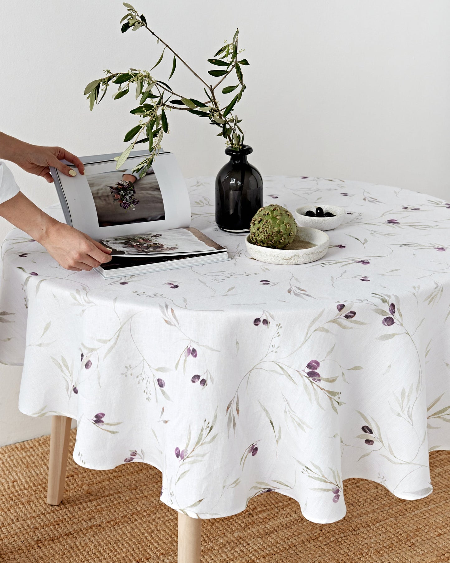 Round linen tablecloth in Olive orchard print on white | MagicLinen