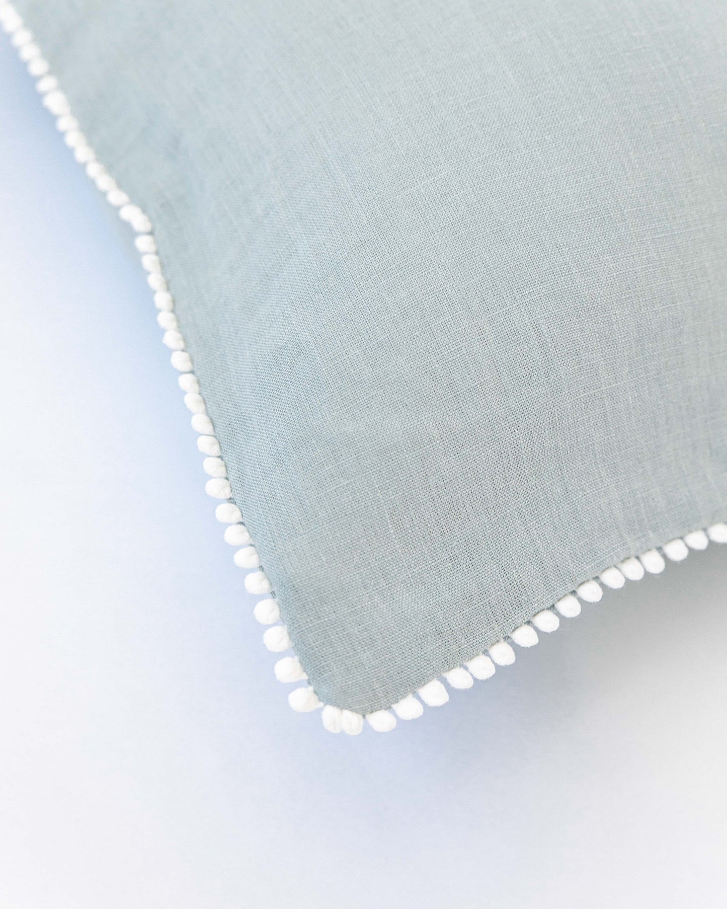 Pom pom trim linen pillowcase in Dusty Blue - MagicLinen