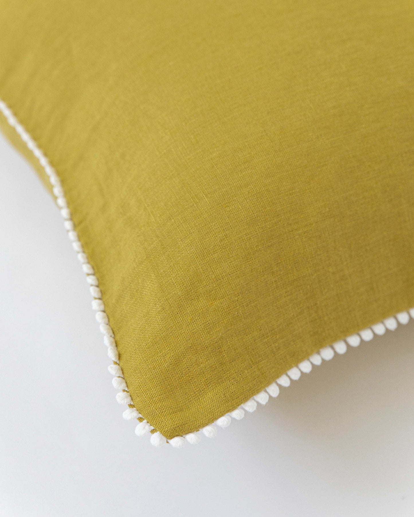 Pom pom trim linen pillowcase in Moss yellow - MagicLinen