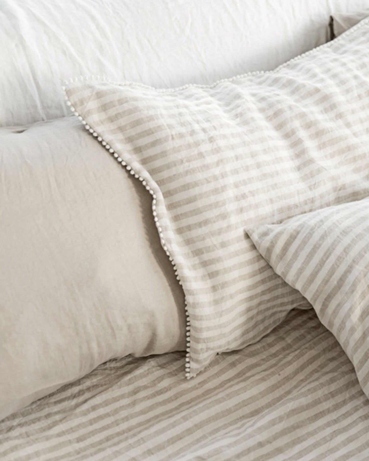 Pom pom trim linen pillowcase in Striped in natural - MagicLinen