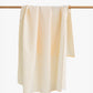 Linen beach towel in Striped yellow - MagicLinen