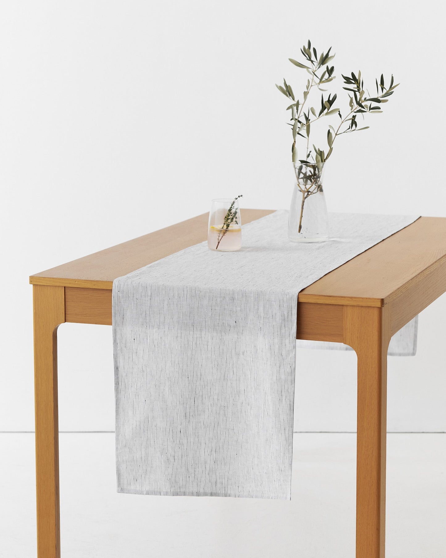 Linen table runner in Pinstripe black