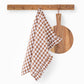 Ruffle trim linen tea towel in Cinnamon gingham - MagicLinen